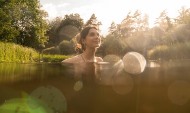 Our natural swimming pond at the wellness hotel, Bavaria